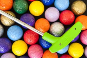 miniature golf club and balls 